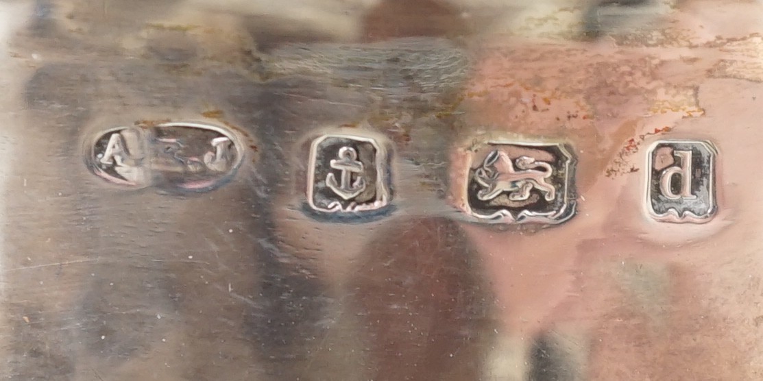 An Edwardian Art Nouveau silver pedestal bowl, inset with four oval Ruskin oval cabochons, by Albert Edward Jones